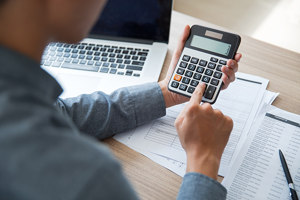 Man using calculators