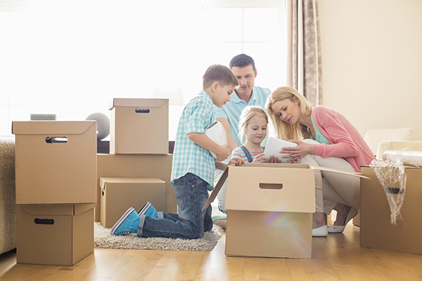 Family with moving boxes